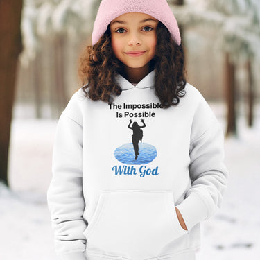 Gildan youth unisex hoodie with “Impossible Girl” design featuring a girl walking on water and uplifting message, Christian apparel made from soft preshrunk fleece, ideal for cooler weather and faith-forward style, girl in white hoodie